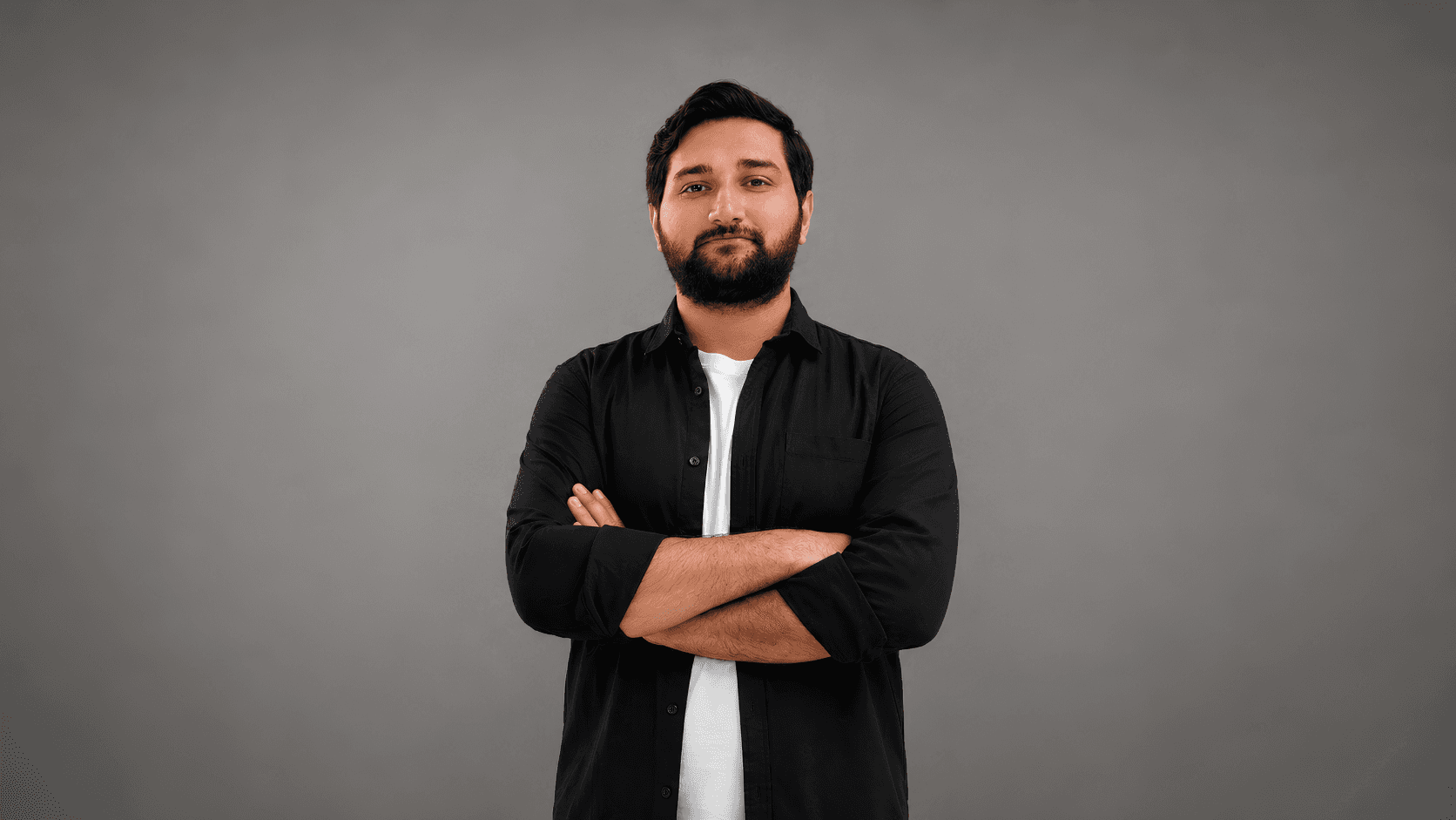 Fazal Abbas standing against a neutral studio backdrop